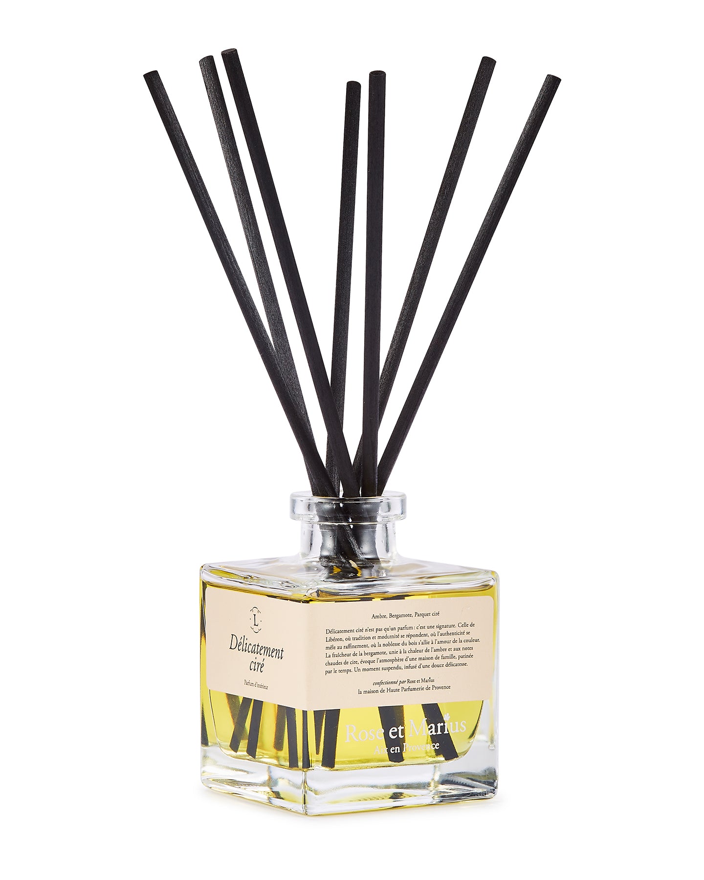 Diffuseur de parfum d’intérieur Libéron Délicatement ciré, flacon en verre avec tiges noires.