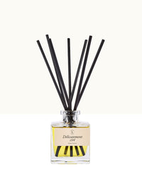 Diffuseur de parfum d’intérieur Libéron, flacon en verre avec tiges noires, senteur Délicatement cirée.
